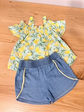 Penelope Mack Light Blue Denim Shorts with Pom Trim and Lemon Shoulder Peek-Top